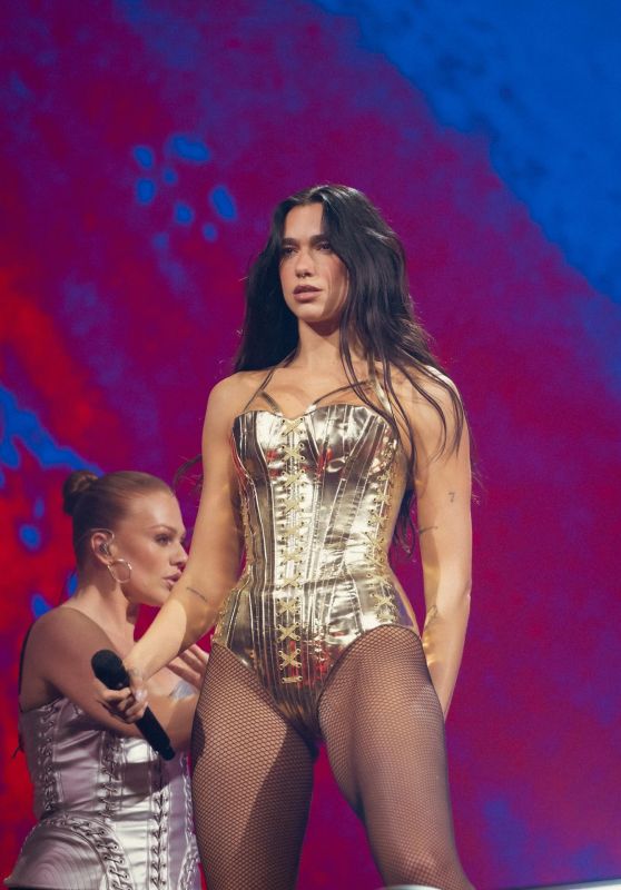 Dua Lipa Dazzles in Golden Corset Bodysuit on Stage