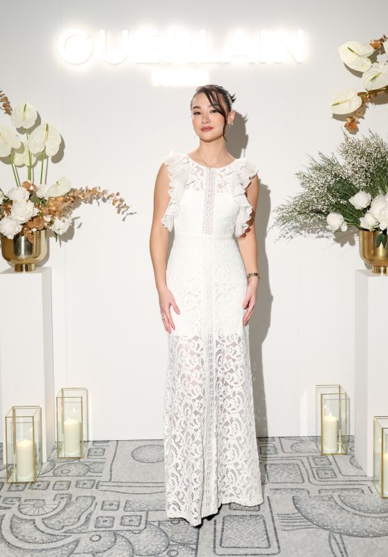 Minnie Mills Shines in White Lace at Guerlain Spa Opening!