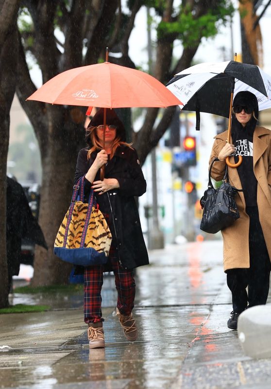 Nicky and Kathy Hilton Brave the Rain in Style!